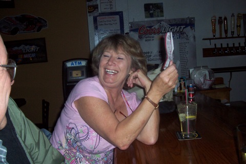 Linda showing off her winning ticket.
