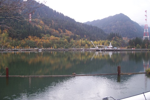 The pond of slack water behind the dam.