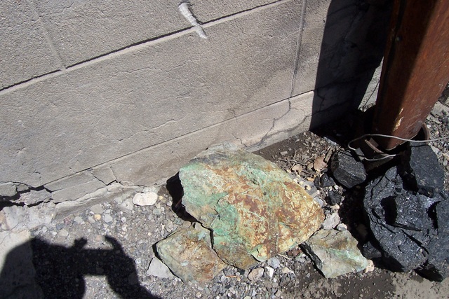Outside the machine shop is a chunk of copper ore. What the mine is all about.